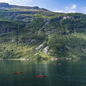 Kayakers in Geirangerfjord, Sunmore Kayakers in Geirangerfjord, Sunmore