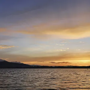 Kitesurfer on Lake Zug at sunset