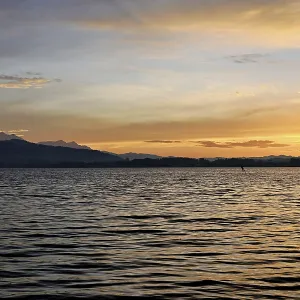 Kitesurfer on Lake Zug at sunset