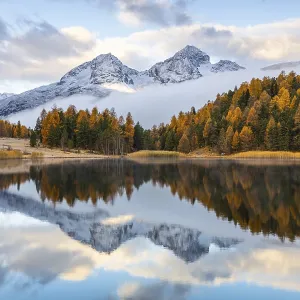 Lake Stazer in front of mountain peaks with snow Lake Stazer in front of mountain peaks with snow