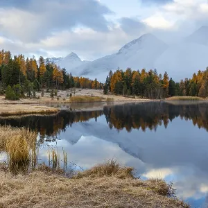 Lake Stazer in front of mountain peaks with snow Lake Stazer in front of mountain peaks with snow