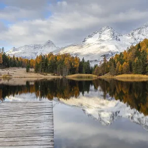 Lake Stazer in front of mountain peaks with snow Lake Stazer in front of mountain peaks with snow