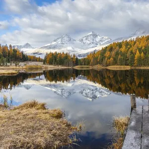 Lake Stazer in front of mountain peaks with snow Lake Stazer in front of mountain peaks with snow