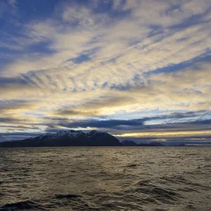 Landscape, Atlantic Ocean with mountains and moody cloudy sky at Tromvik