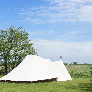 Landscape Camping with tent in meadows with sheeps