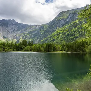 Landscape of Lake Offensee after rain when the sun comes through the clouds in spring