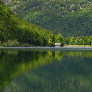 Landscape of Lake Offensee after rain when the sun comes through the clouds in spring