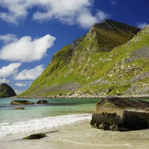 Landscape with sea at the sandy beach of Haukland (Hauklandstranda) with the mountain Veggen Landscape with sea at the sandy beach of Haukland (Hauklandstranda) with the mountain Veggen