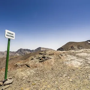 Landscape of Sierra Nevada Mountains with sign saying National Park
