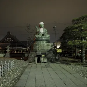Large Buddha statue in front of a temple Large Buddha statue in front of a temple
