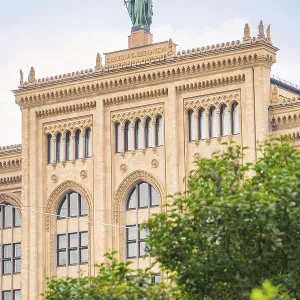 Large historic building with statue on the roof