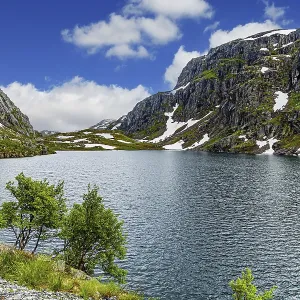 Large snowfields is reflected in the water of the lake Large snowfields is reflected in the water of the lake
