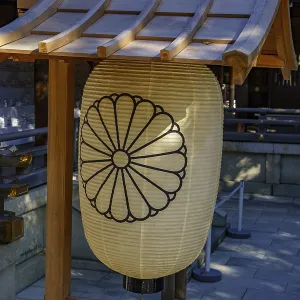 Large traditional chrysanthemum pattern lantern at the entrance of a Japanese temple Large traditional chrysanthemum pattern lantern at the entrance of a Japanese temple