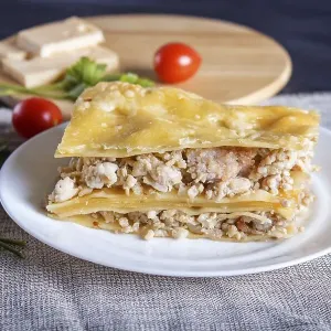 Lasagna with minced meat and cheese on black wooden background Lasagna with minced meat and cheese on black wooden background