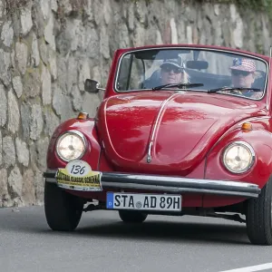 Laterally offset frontal view of the red VW Beetle Convertible 1300 LS with start number 136 Laterally offset frontal view of the red VW Beetle Convertible 1300 LS with start number 136