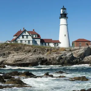 Lighthouse, waves breaking on rocks