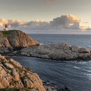 Lindesnes lighthouse at rocky coast Lindesnes lighthouse at rocky coast