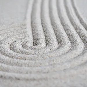 Lines and circle formation on beach sand with customizable space for text