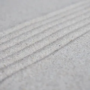 Lines formation on beach sand with customizable space for text