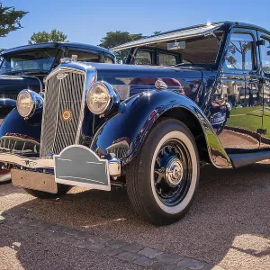 Lisbon, Portugal - Sep 29, 2024: Vintage blue Wolseley 18 85 parked on cobblestone road on sunny day