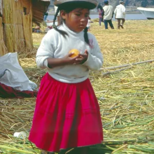 Little girl on a floating Uro island in Lake Titcaca