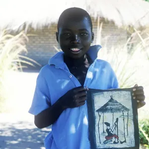 Local boy showing homemade artwork Local boy showing homemade artwork