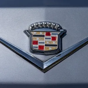 Logo Cadillac on vintage car Coupe DeVille at the rear