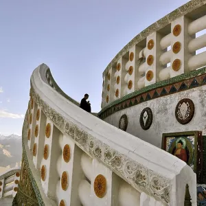A lone Buddhist engrossed in prayers at a monastery in Leh