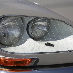 Look out for the model car in the headlights of this classic car! Look out for the model car in the headlights of this classic car!