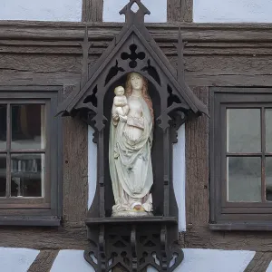 Madonna figure on a half-timbered facade