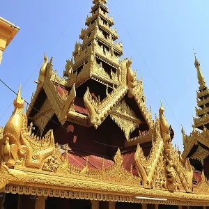 Magnificent golden temple spires of Shwezigon Pagoda against a clear blue sky in Nyaung-U Magnificent golden temple spires of Shwezigon Pagoda against a clear blue sky in Nyaung-U