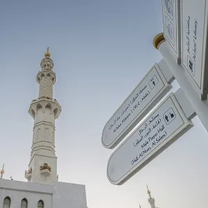 The majestic Sheikh Zayed Grand Mosque and sign in Abu Dhabi