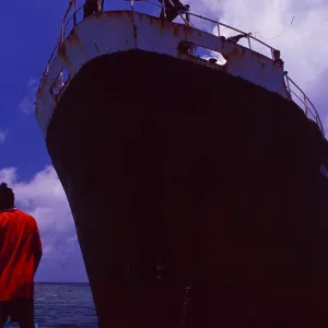 Maldives: Dhoni on the bow of a cargo ship Maldives: Dhoni on the bow of a cargo ship