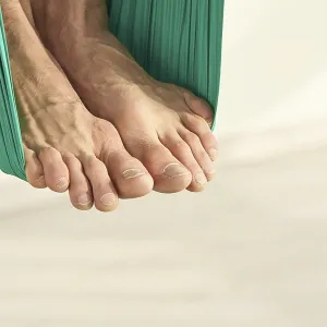 Male person do hammock yoga class exercise Male person do hammock yoga class exercise