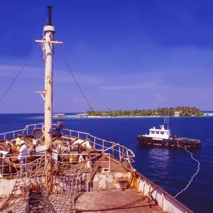 Male: A red freighter is sunk off Makafushi Island to form the basis for a coral reef Male: A red freighter is sunk off Makafushi Island to form the basis for a coral reef