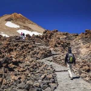 Man going to the top of the volcano Teide in Tenerife