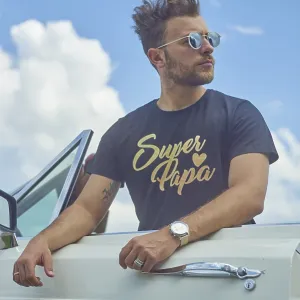 Man leaning on a white convertible with sunglasses against a bright blue sky with clouds