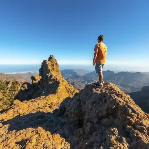 A man looking at the top of Pico de las Nieves in Gran Canaria A man looking at the top of Pico de las Nieves in Gran Canaria