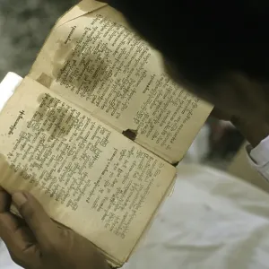 Man reading Buddhist writings, Burma Man reading Buddhist writings, Burma