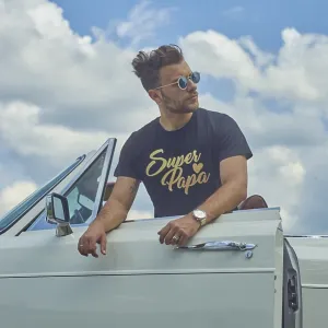 Man in sunglasses leaning on a white convertible car with a cloudy sky backdrop