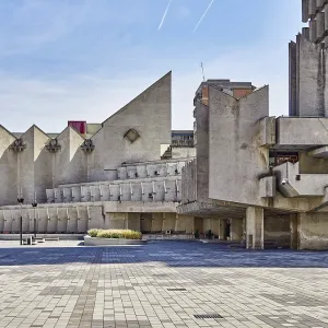 Massive brutalist concrete architecture in an urban environment with geometric shapes Massive brutalist concrete architecture in an urban environment with geometric shapes
