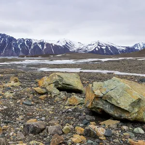 Melting glacier, copper-bearing stones Melting glacier, copper-bearing stones