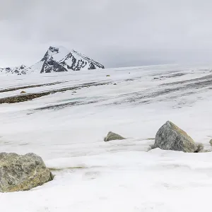 Melting glacier, stones, water Melting glacier, stones, water