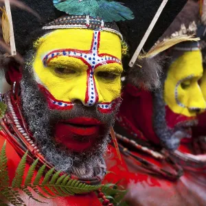Men in colourfully decorated costumes with face Men in colourfully decorated costumes with face