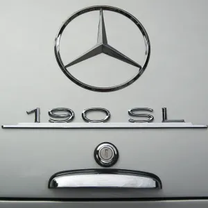 Mercedes star on boot of a silver vintage Mercedes 190 SL Mercedes star on boot of a silver vintage Mercedes 190 SL
