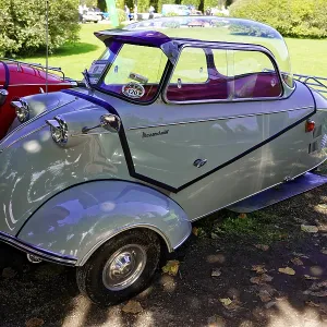 Messerschmidt KR 200, A white three-wheeled Messerschmitt classic car presented in a meadow