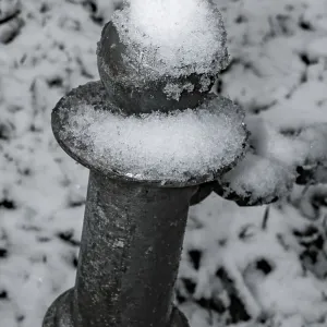 Metal pile with snow in the park