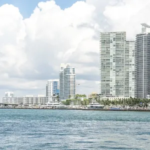 Miami skyline with skyscrapers and bridge over the sea Miami skyline with skyscrapers and bridge over the sea