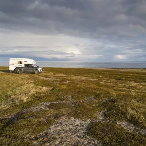 Mobile Camper parked near the Arctic Ocean shore Mobile Camper parked near the Arctic Ocean shore