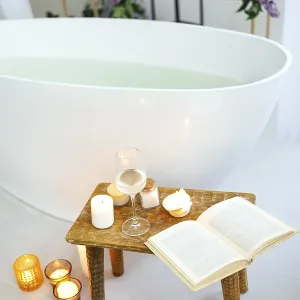 Modern bath room and spa center on the white tub wooden table Modern bath room and spa center on the white tub wooden table